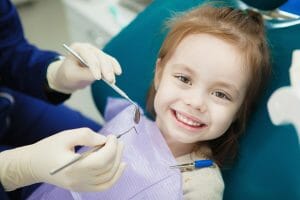 Little girl getting a dental checkup